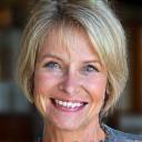 Ellen, 52, smiling warmly, showcasing her improved vitality.