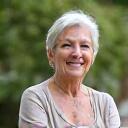 Susan, 55, engaged in a peaceful, mindful activity outdoors.